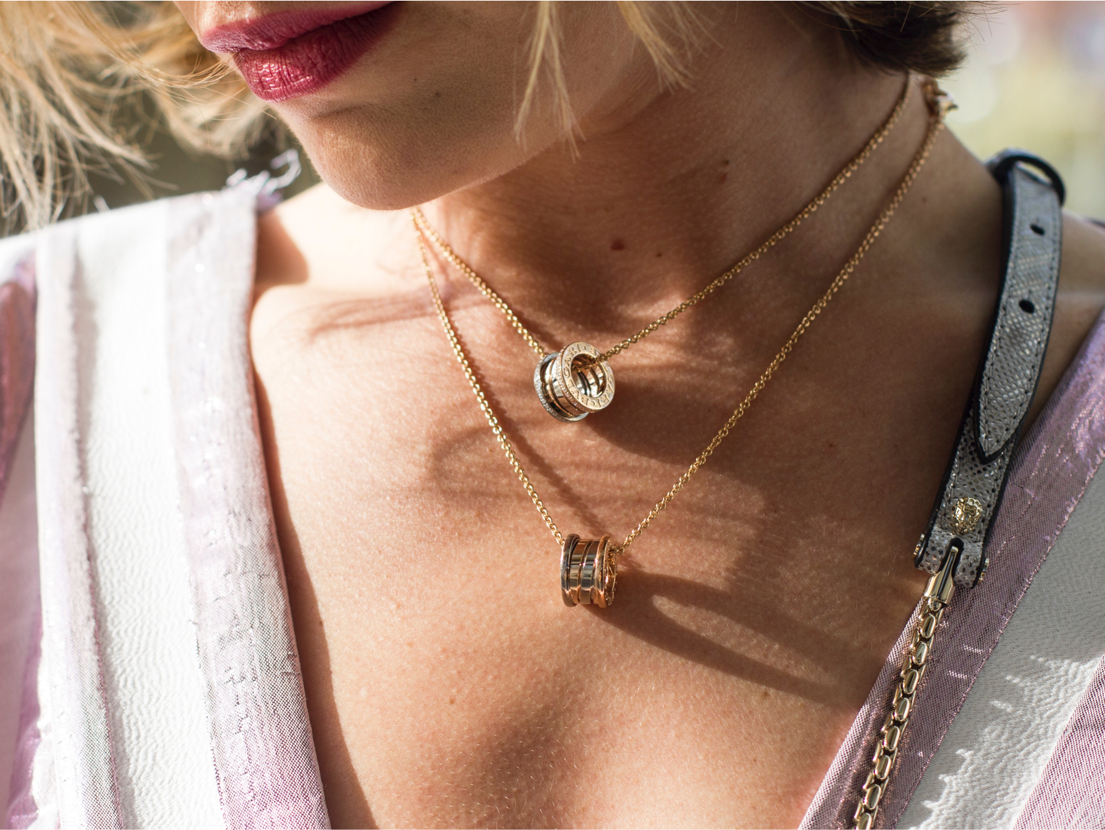 Two necklaces on a woman's neck